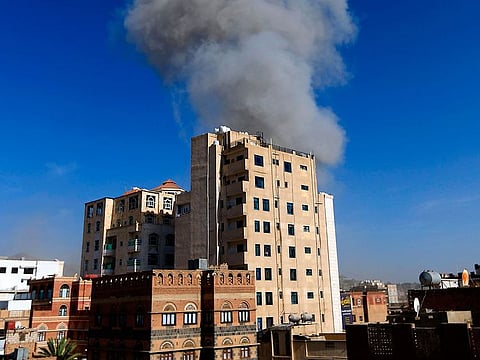 Smoke billows following an air strike in the Yemeni capital Sanaa.