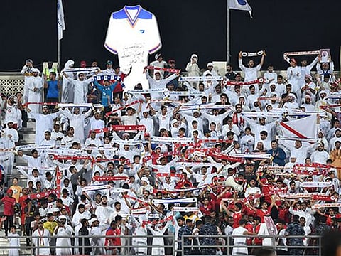 Sharjah FC fans in jubilation after winning the Arabian Gulf League on Wednesday night.