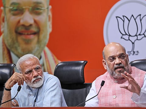 Indian Prime Minister Narendra Modi [L] Bharatiya Janata Party (BJP) President Amit Shah [R] 