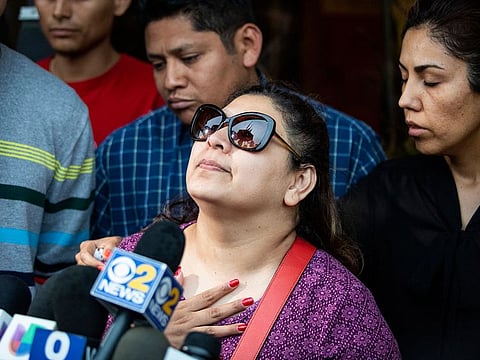 Surrounded by family members and supporters, Marlen Ochoa-Lopez's mother, Raquel Uriostegui, talks to reporters outside the Cook County medical examiner's office after identifying her daughter's body.