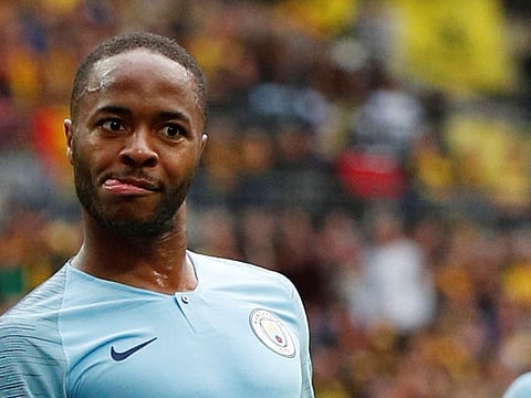Manchester City's Raheem Sterling celebrates scoring their fifth goal with Leroy Sane as Watford's Adrian Mariappa looks dejected 