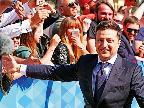 Volodymyr Zelenskiy greeds supporters before inauguration ceremony in Kiev, on Monday. 