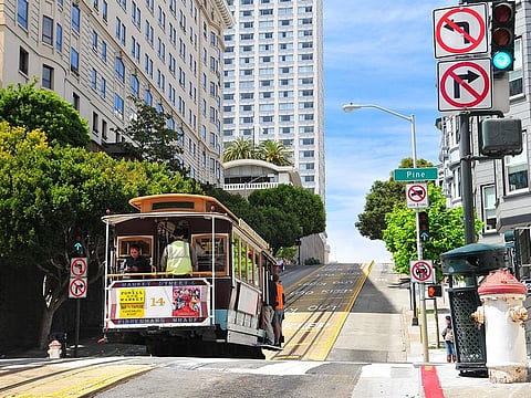 Traditional Cable Cars riding on famous California Street, San Francisco, California .Photo for illustrative purposes.