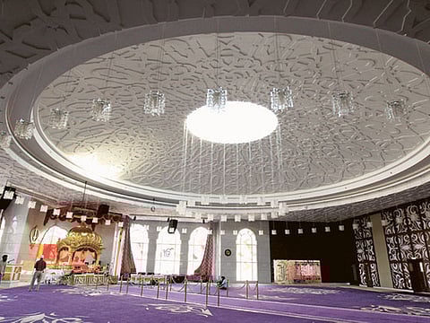 The four-level gurudwara in Jebel Ali sprawls a massive 100,000 square feet with a prayer hall, above, that can accommodate up to 3,000 people