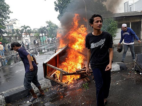Men take part in a protest following the announcement of last month's election official results in Jakarta, Indonesia, May 22, 2019.