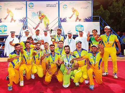 MGM celebrate after winning the NAS cricket tournament on Wednesday night.