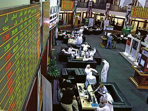 File picture of investors at Dubai Financial Market. Next few days could see a bout of profit-taking activity. 