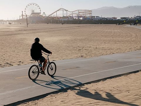 A man rides a bike along the beach in Santa Monica, California. A promising new study links exercise, memory and ageing