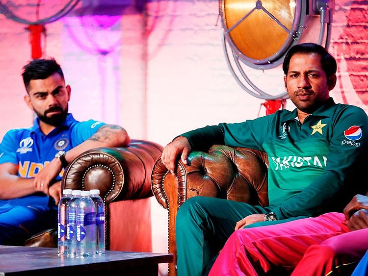 India's Virat Kohli (left) and Pakistan's Sarfraz Ahmad