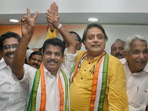 Congress candidate from Thiruvananthapuram constituency Shashi Tharoor and congress candidate from Attingal constituency Adoor Prakash celebrate their lead during the counting of votes of Lok Sabha elections, in Thiruvananthapuram, on Thursday. 