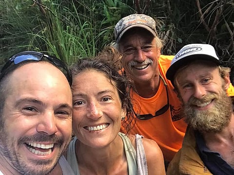Missing hiker Amanda Eller (2nd L) with her rescuers, (L-R) Javier Cantellops, Troy Helmer and Chris Berquist, on May 24, 2019, at Makawao Forest Reserve on the Hawaiian Island of Maui. Eller, 35, was reported missing on May 8, prompting a massive search.  