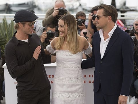 Actors Brad Pitt, from left, Margot Robbie and Leonardo DiCaprio pose for photographers at the photo call for the film 'Once Upon a Time in Hollywood' at the 72nd international film festival, Cannes, southern France, Wednesday, May 22, 2019. (Photo by Joel C Ryan/Invision/AP)