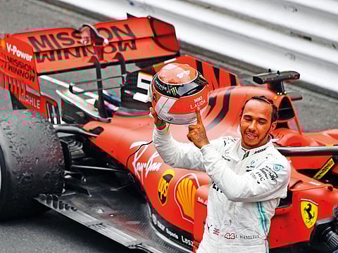 Lewis Hamilton shows off the Mercedes spirit after winning the Monaco Grand Prix yesterday.