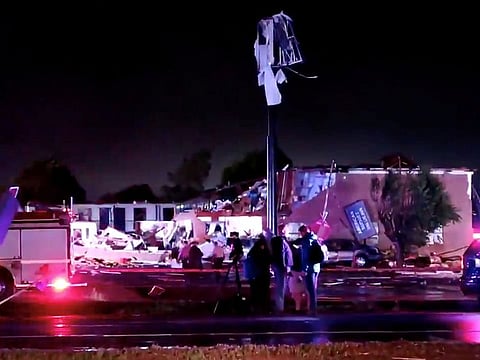 Emergency vehicles sit near a partially collapsed building after a tornado touched down in El Reno, Oklahoma, U.S., May 26, 2019