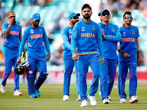India's Captain Virat Kohli (C) leads the team off the field of play after India are beaten by 6 wickets during the 2019 Cricket World Cup warm up match between India and New Zealand at The Oval in London on May 25, 2019.