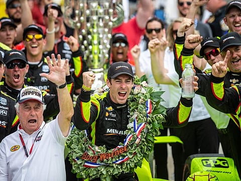 TOPSHOT - Simon Pagenaud of France, driver of the #22 Menards Team Penske Chevrolet celebrates after winning the 103rd running of the Indianapolis 500 at Indianapolis Motor Speedway on May 26, 2019 in Indianapolis, Indiana. France's Simon Pagenaud won the 103rd Indianapolis 500 Sunday, holding off Alexander Rossi in a fierce finishing duel to win America's fabled race for the first time. Penske driver Pagenaud started from pole position and led 116 laps of the 200-lap race on the 2.5-mile oval of the Indianapolis Motor Speedway, finishing in front of two former winners in Andretti Autosport's Rossi and Rahal Letterman Lanigan Racing's Takuma Sato of Japan.
 / AFP / Kerem Yucel