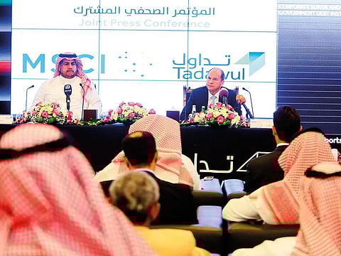 Saudi bourse CEO Khalid Abdullah Al Hussan with MSCI Inc CEO Henry Fernandez. MSCI added the kingdom to its developing country benchmark, using Tuesday’s closing prices.