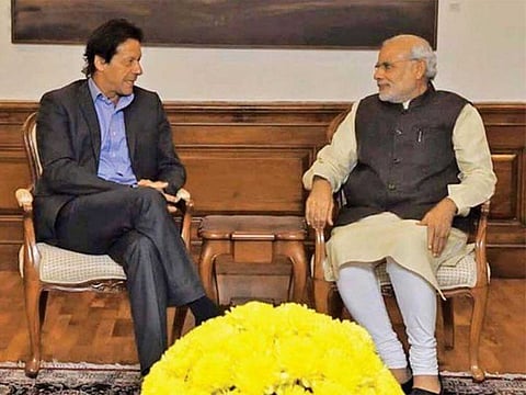 Indian Prime Minister Narendra Modi and Pakistani Prime Minister Imran Khan during a meeting. File photos