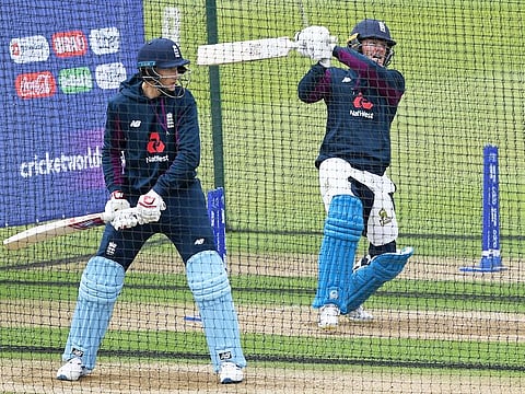 England's Joe Root (L) and England's captain Eoin Morgan (R) take part in a nets practice session on the eve of their opening match of the ICC Cricket World Cup against South Africa, at The Oval in London on May 29, 2019.