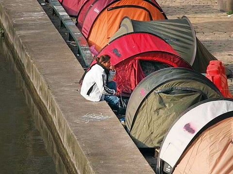File photo: Tents for homeless people line the Canal Saint Martin in Paris.
