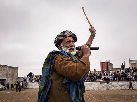 An announcer riles up the audience before a dogfight in Mazar-i-Sharif, Afghanistan