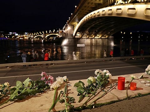 Flowers are placed near the site of a ship accident, which killed several people, on the Danube river in Budapest, Hungary, May 30, 2019.