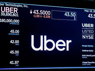 Uber posts $1b loss in first earnings report since IPO