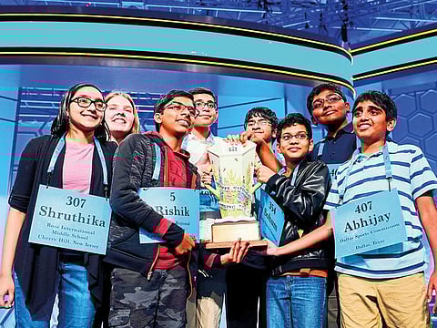 Shruthika Padhy, 13, of Cherryhill, New Jersey, Erin Howard, 14, of Huntsville, Alabama, Rishik Gandhasri, 13, of San Jose, California, Christopher Serrao, 13, of Whitehouse Station, New Jersey, Saketh Sundar, 13, Clarksville, Maryland, Sohum Sukhatankar, 13, of Dallas, Texas, Rohan Raja, 13, of Irving, Texas and Abhijay Kodali, 12, of Flower Mound, Texas celebrate their eight-way tie in the final round of the 92nd annual Scripps National Spelling Bee at National Harbor in Oxon Hill, Maryland, on May 31, 2019.   