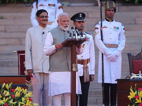 Narendra Modi takes oath for a second term as India's prime minister during a swearing-in ceremony at the Presidential Palace in New Delhi.