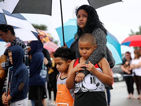 People gather for a vigil in response to a shooting at a municipal building in Virginia Beach, Virginia.