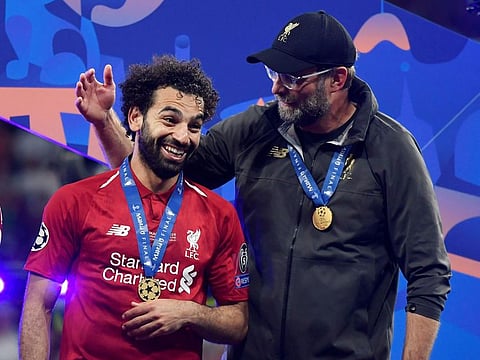 Liverpool coach Jurgen Klopp with Mo Salah after their Champions League win on Saturday.