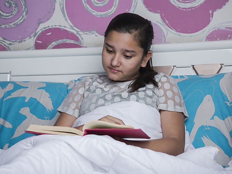 tab An Indian girls reading a book-1559558356169