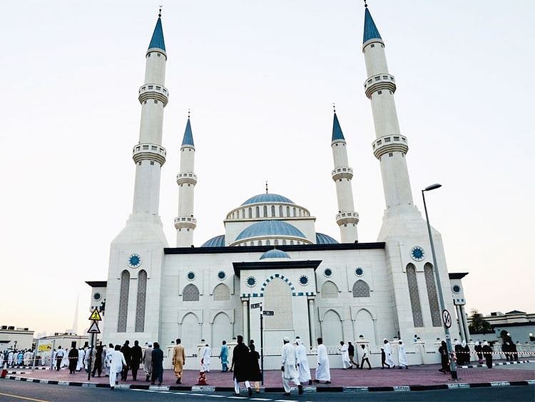 People attend the morning prayers