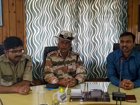 Pithoragarh District Magistrate Vijay Kumar (R) speaks as Indo-Tibetan Border Police (ITBP) Deputy Inspector General of Police (DIG) A. P. S. Nambadia (C) looks on during a press conference in Pithoragarh on June 5, 2019, after failed attempts to retrieve the bodies of climbers. 