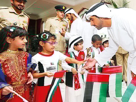 Shaikh Hamdan greets children as part of UAE Flag Day celebrations in 2015. Following in the footsteps of his father, the Dubai Crown Prince has endeared himself alike to both Emiratis and expats.