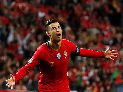Portugal's Cristiano Ronaldo celebrates scoring their third goal to complete his hat-trick.