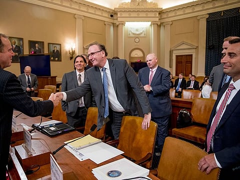 Chairman Rep. Adam Schiff, D-Calif., left, greets State Department Bureau of Intelligence and Research Office of Geography and Global Affairs Senior Analyst Dr Rod Schoonover, second from right, Office of the Director of National Intelligence National Intelligence Council counselor Peter Kiemel, center, and Senior Naval Intelligence Manager for Russia and Eurasia Jeff Ringhausen, right, appear before a House Intelligence Committee hearing on national security implications of climate change on Capitol Hill in Washington, Wednesday, June 5, 2019. 