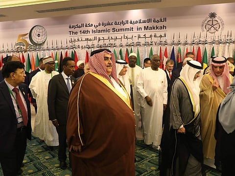 Bahrain's Foreign Minister Khalid bin Ahmed Al Khalifa (C) leaves after a family photo during a meeting of Islamic and Arab Foreign Ministers in Jeddah on May 30, 2019,  ahead of the Gulf, Arab, and Islamic summit to be held in Mecca on 30 and 31 May 2019.