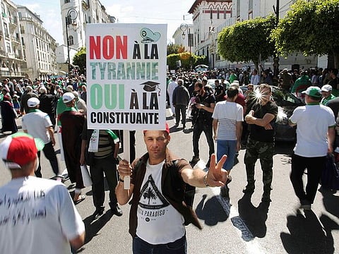 Algerian protesters gather during an anti-government demonstration in the centre of the capital Algiers, Algeria, Friday, May 31, 2019. Banner in French reads: "No to tyranny, yes to constitution."