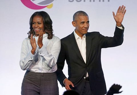 Former President Barack Obama, right, and former first lady Michelle Obama.