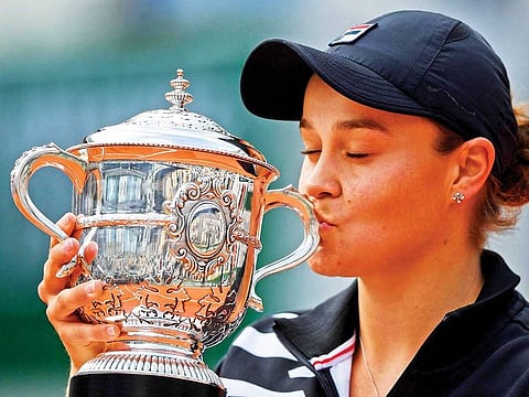 Ashleigh Barty of Australia savours her moment of triumph after winning the French Open last year. 