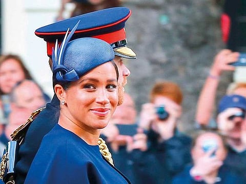 Britain's Prince Harry and Meghan, Duchess of Sussex take part in the Trooping the Colour parade in central London