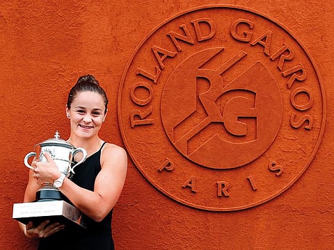 Australia’s Ashleigh Barty poses with the trophy at the Roland Garros stadium in Paris