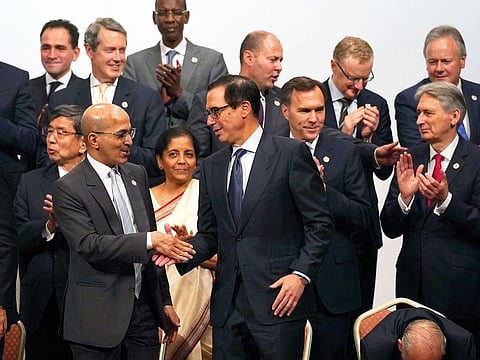 US Treasury Secretary Steven Mnuchin, right, and Saudi Finance Minister Mohammad Al Jadaan and others at the G20 finance ministers and central bank governors meeting on Sunday.
