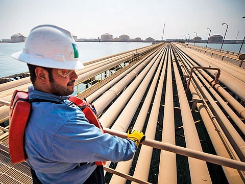 Pipes containing oil stand at the North Pier terminal of Aramco's Ras Tanura oil refinery and oil terminal in Ras Tanura, Saudi Arabia . 