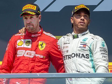 Mercedes driver Lewis Hamilton with Ferrari's Sebastian Vettel.