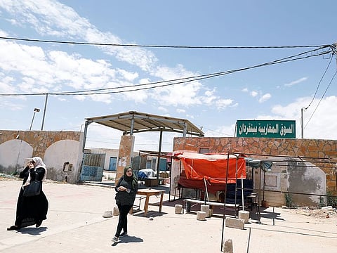 Women walk near "Souk Libya" marketplace in the town of Ben Guerdane, near the Libyan border in Tunisia May 24, 2019.