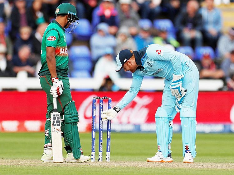 England's Jonny Bairstow inspects the stumps