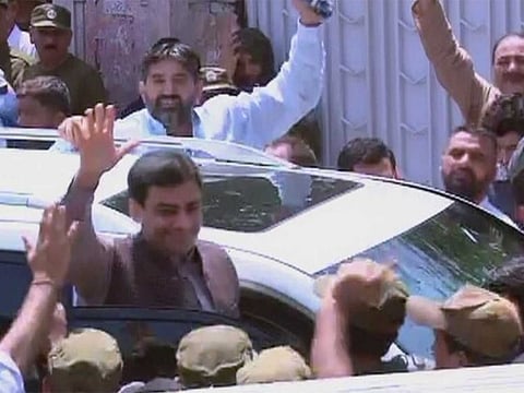 Hamza Shahbaz waving to his supporters at the time of his arrest in the Lahore High Court premises