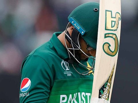 Pakistan's Imam-ul-Haq walks from the pitch after being given out caught behind during the Cricket World Cup match between Australia and Pakistan at the County Ground in Taunton, south west England, Wednesday, June 12, 2019